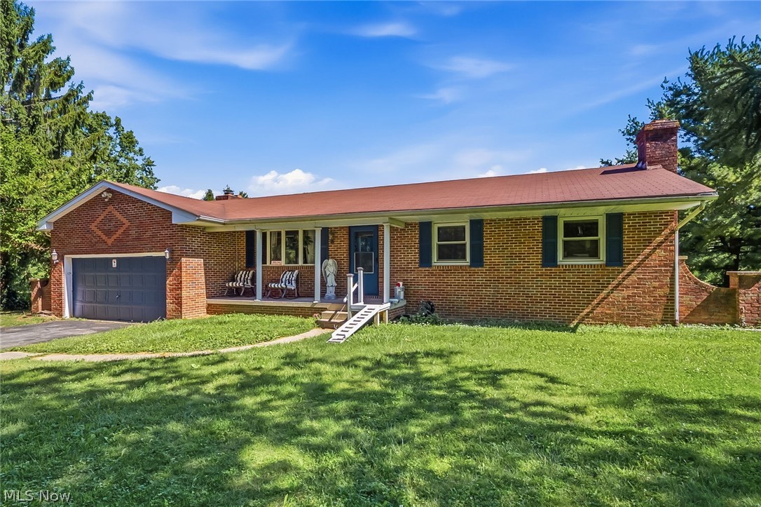 6890 Refugee Road Pickerington, OH 43147 - Photo 4 of 49 Brick ranch-style residence featuring a prominent front lawn