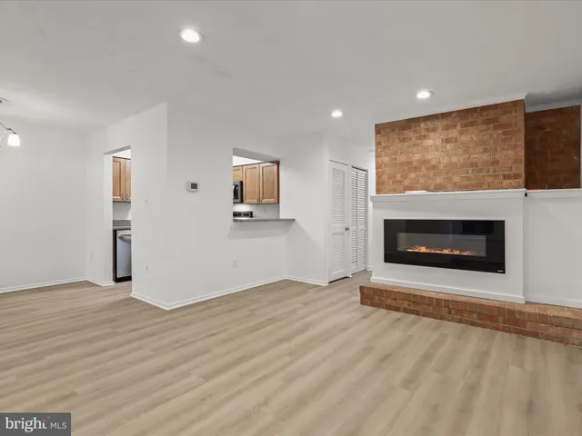 a view of an empty room with a fireplace