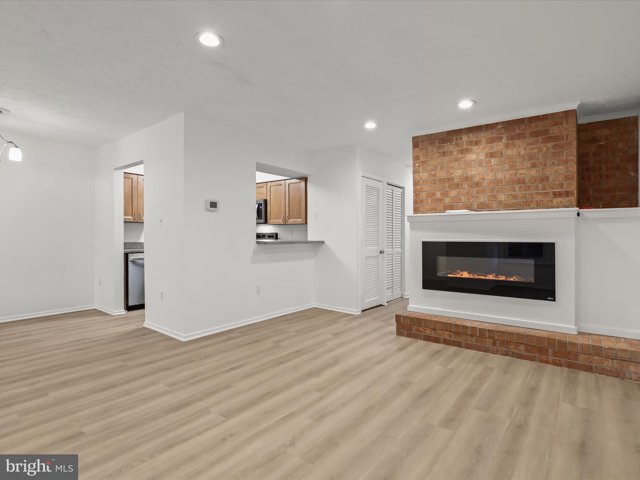 7517 Weather Worn Way, Unit A Columbia, MD 21046 - Photo 12 of 27 a view of an empty room with a fireplace