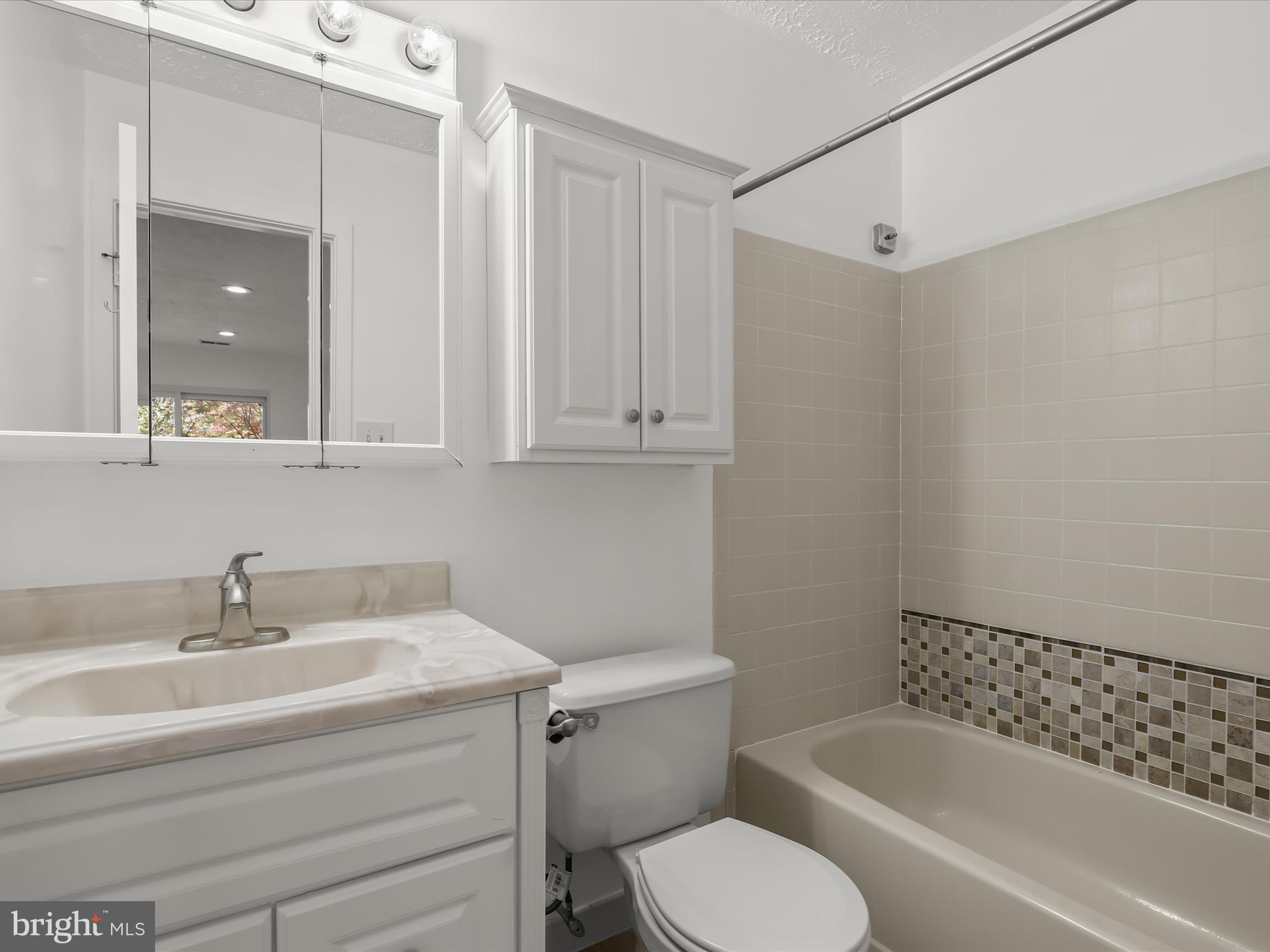 7517 Weather Worn Way, Unit A Columbia, MD 21046 - Photo 16 of 27 a bathroom with a sink toilet and shower