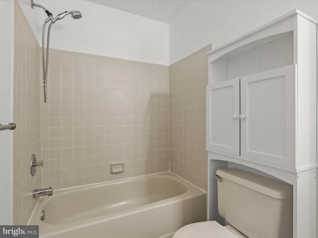 a bathroom with a bathtub and shower