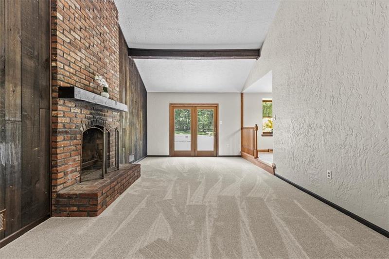 116 Foxglove Road Baden, PA 15005 - Photo 14 of 42 a view of livingroom with fireplace and window