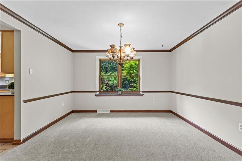 116 Foxglove Road Baden, PA 15005 - Photo 17 of 42 a view of an empty room with a window