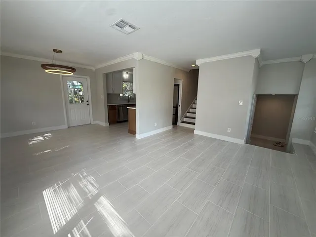 a view of a livingroom with wooden floor and closet