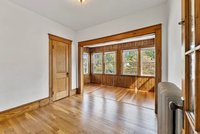 a view of an empty room with glass door
