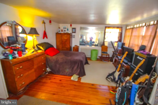 a bedroom with furniture and a window