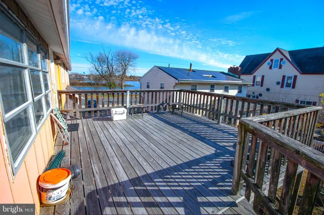 a view of a balcony with wooden floor