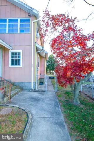 a view of a house with brick walls
