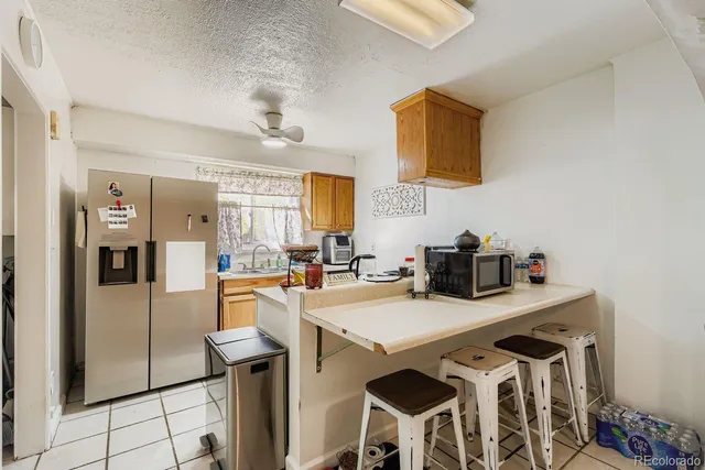 a bedroom with a large bed and a large window