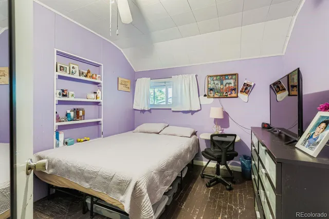 a bedroom with a bed and a bookshelf