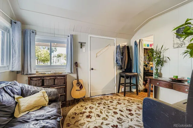 a kitchen that has a lot of cabinets a stove and a refrigerator