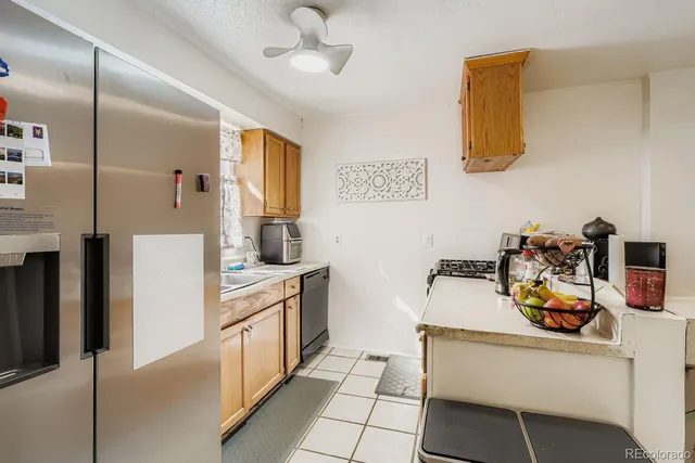 a kitchen with a sink appliances and cabinets