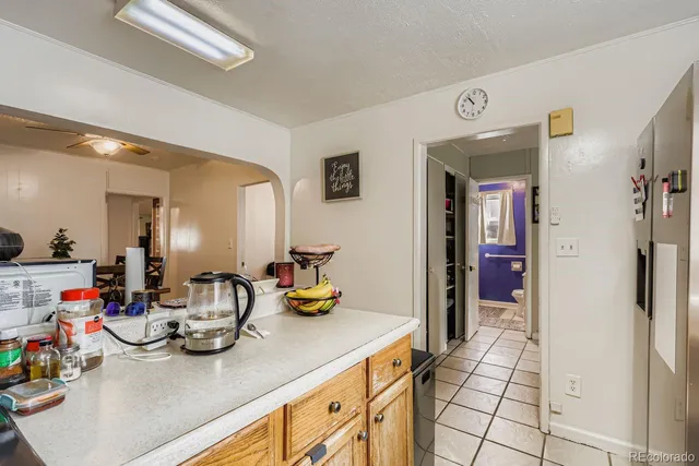 a kitchen with stainless steel appliances a sink a refrigerator and a stove