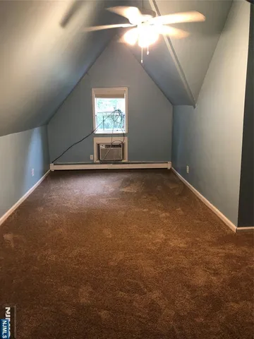 an empty room with a empty space and windows