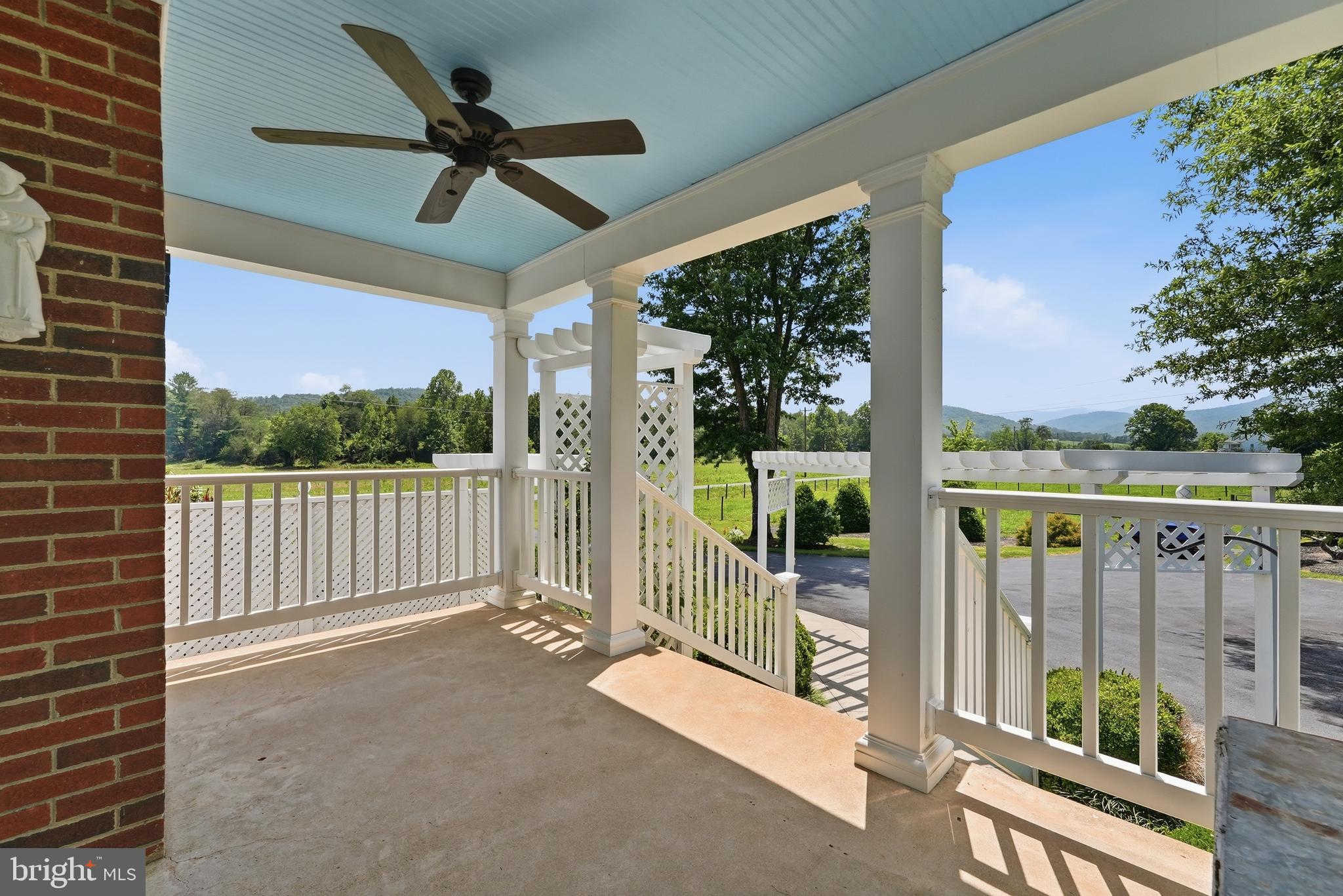 6117 South F T Valley Road Etlan, VA 22719 - Photo 9 of 36 Side porch w/ western view of Blue Ridge Mountains
