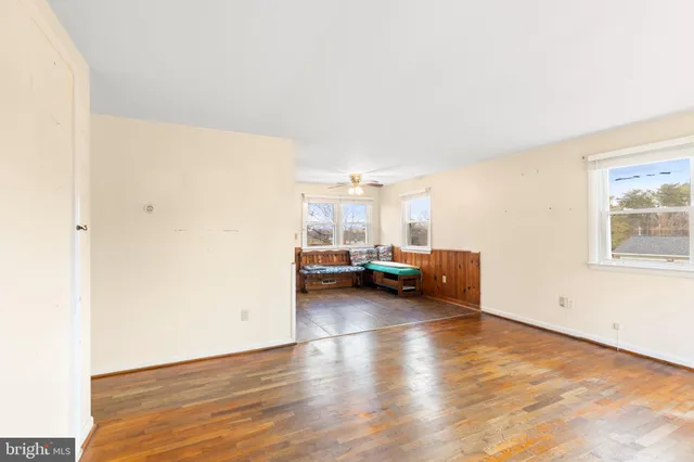 a view of a livingroom with furniture and cars
