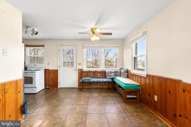 a living room with furniture and windows