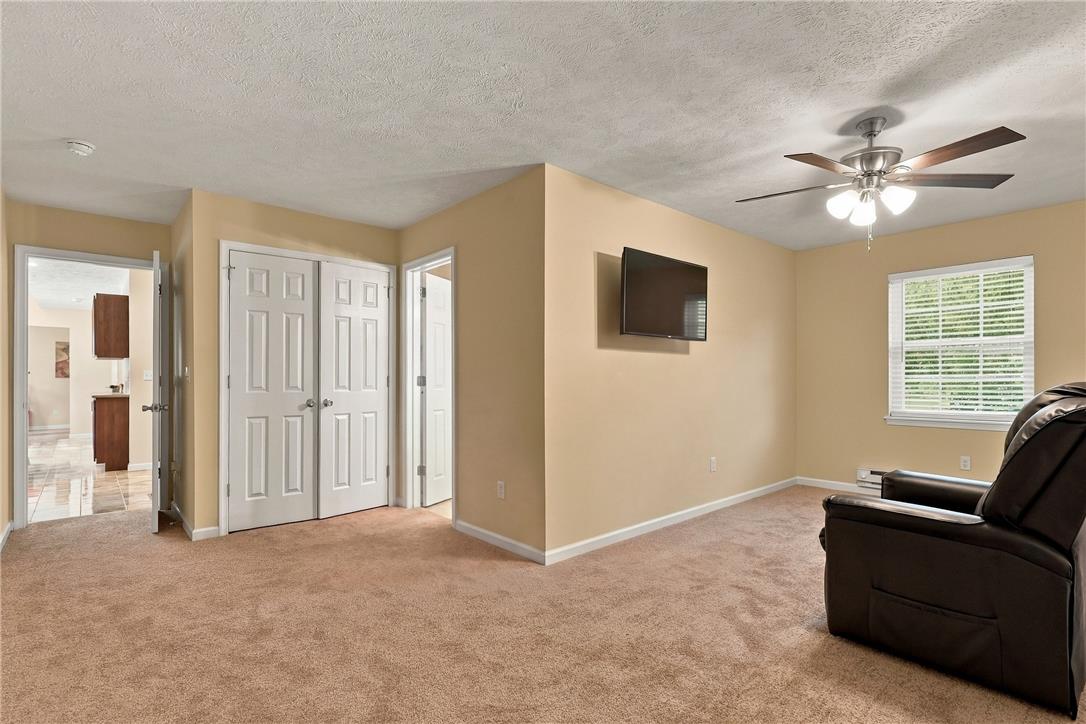1657 Rachel Road Stroudsburg, PA 18360 - Photo 31 of 46 Plush wall-to-wall carpeting and neutral tones create a comfortable, inviting living space.