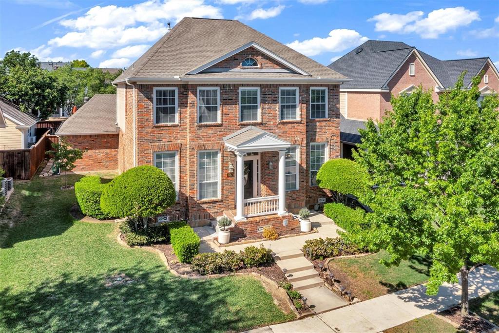 1747 Ivy Lane Carrollton, TX 75007 - Photo 1 of 21 a front view of a house with a yard