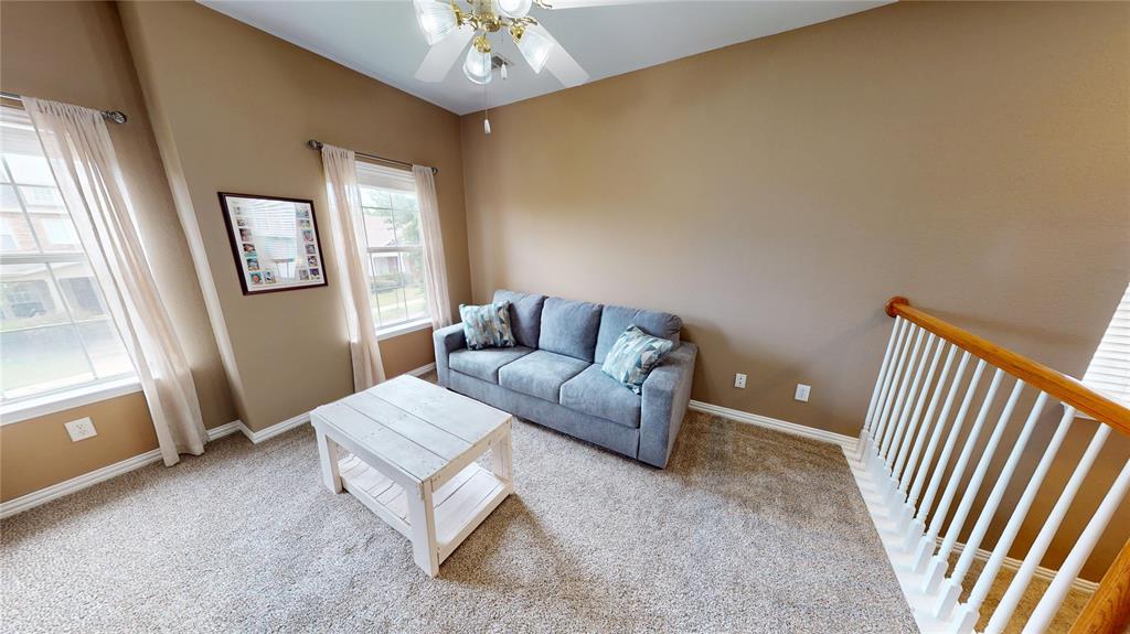 1747 Ivy Lane Carrollton, TX 75007 - Photo 11 of 21 a living room with furniture and a chandelier