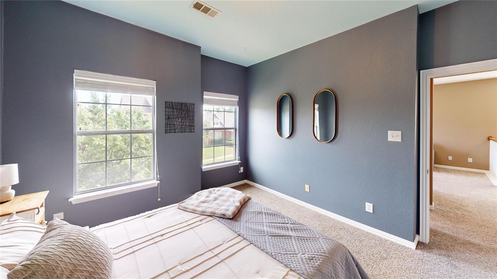 1747 Ivy Lane Carrollton, TX 75007 - Photo 15 of 21 a bedroom with bed and window