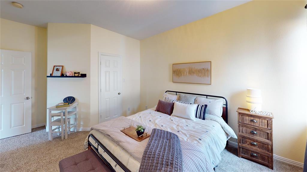 1747 Ivy Lane Carrollton, TX 75007 - Photo 18 of 21 a bedroom with a bed and a window