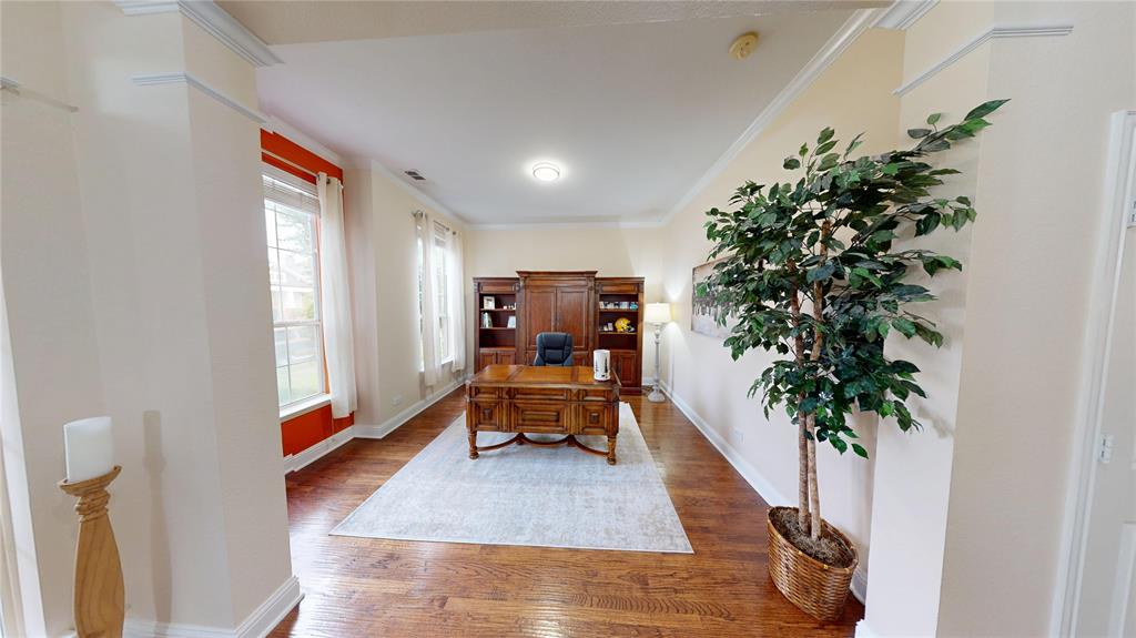 1747 Ivy Lane Carrollton, TX 75007 - Photo 3 of 21 a living room with furniture and a potted plant
