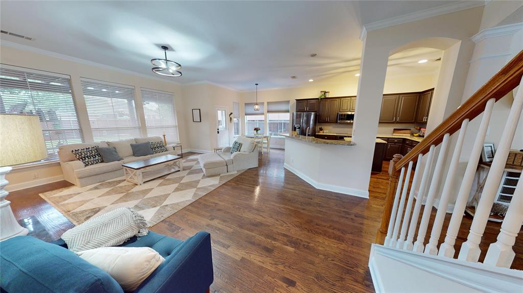 1747 Ivy Lane Carrollton, TX 75007 - Photo 5 of 21 a living room with furniture and a chandelier