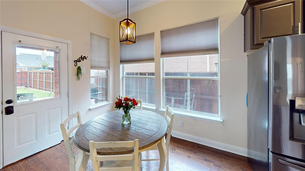 1747 Ivy Lane Carrollton, TX 75007 - Photo 10 of 21 a view of a dining room with furniture window and wooden floor