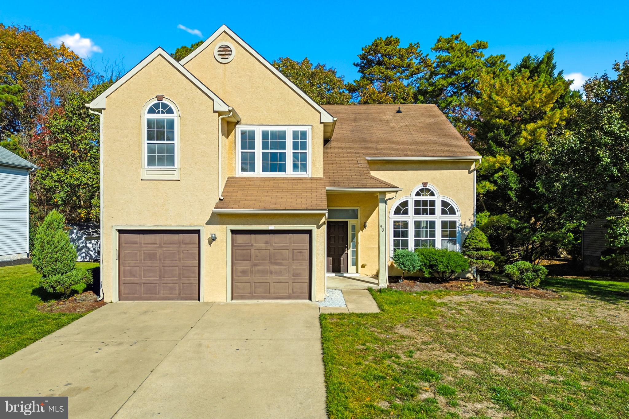 50 Wildcat Branch Drive Sicklerville, NJ 08081 - Photo 1 of 33 a front view of a house with garden