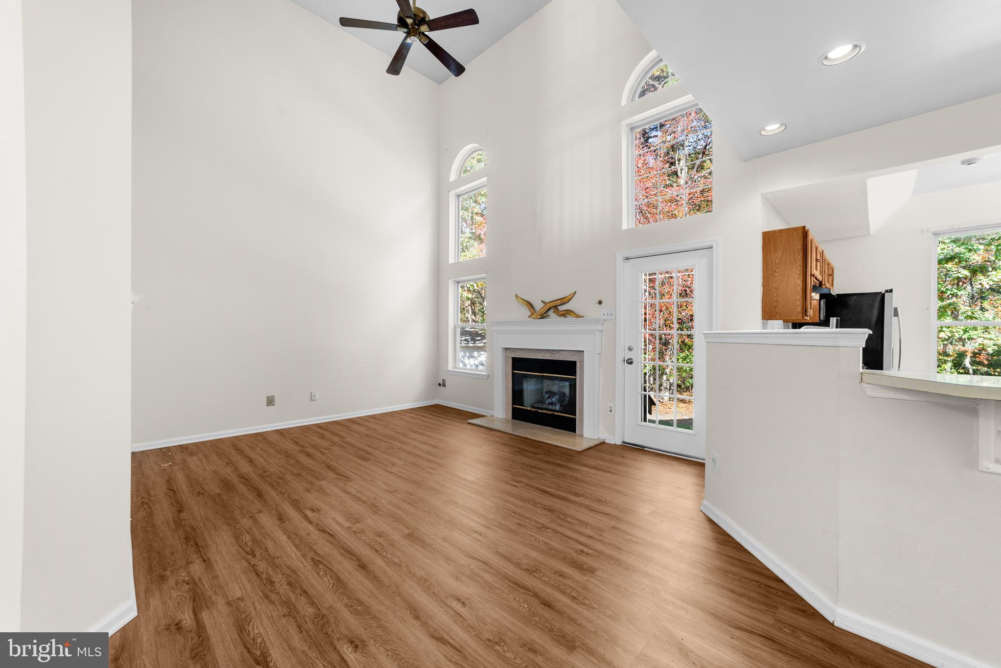 50 Wildcat Branch Drive Sicklerville, NJ 08081 - Photo 13 of 33 a view of a livingroom with a fireplace and a window