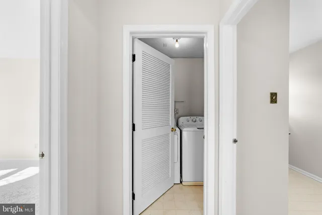 a view of a bathroom from a hallway