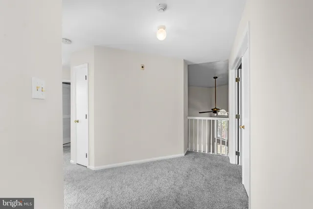 a view of a hallway with a bathroom