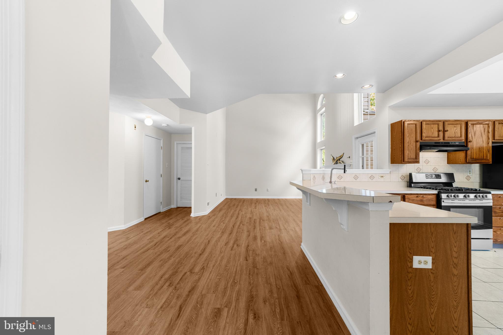 50 Wildcat Branch Drive Sicklerville, NJ 08081 - Photo 9 of 33 a kitchen with kitchen island a sink stove and refrigerator
