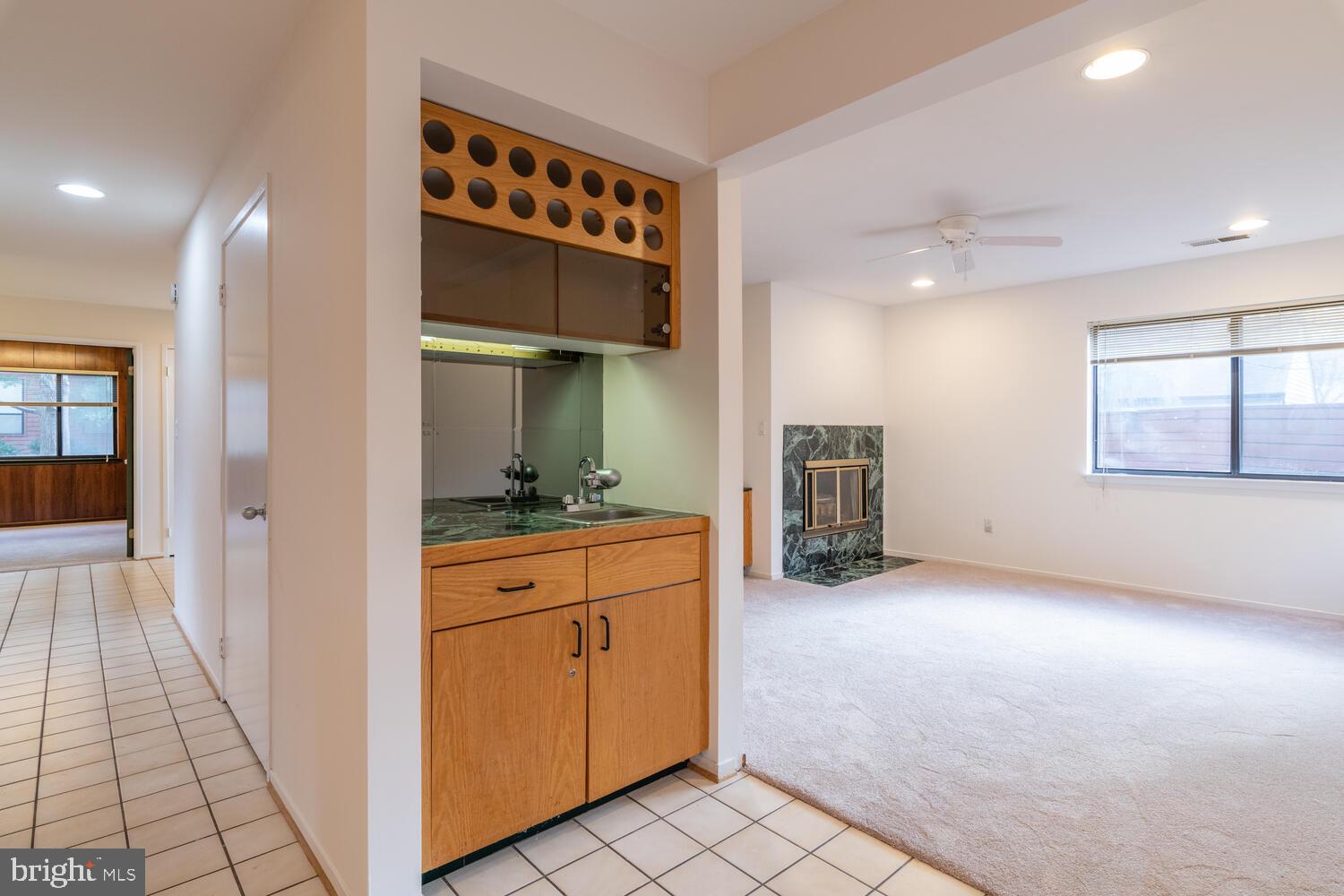 2100 South Bay Lane Reston, VA 20191 - Photo 15 of 43 Wet bar with Wine Rack at Family Room Entrance