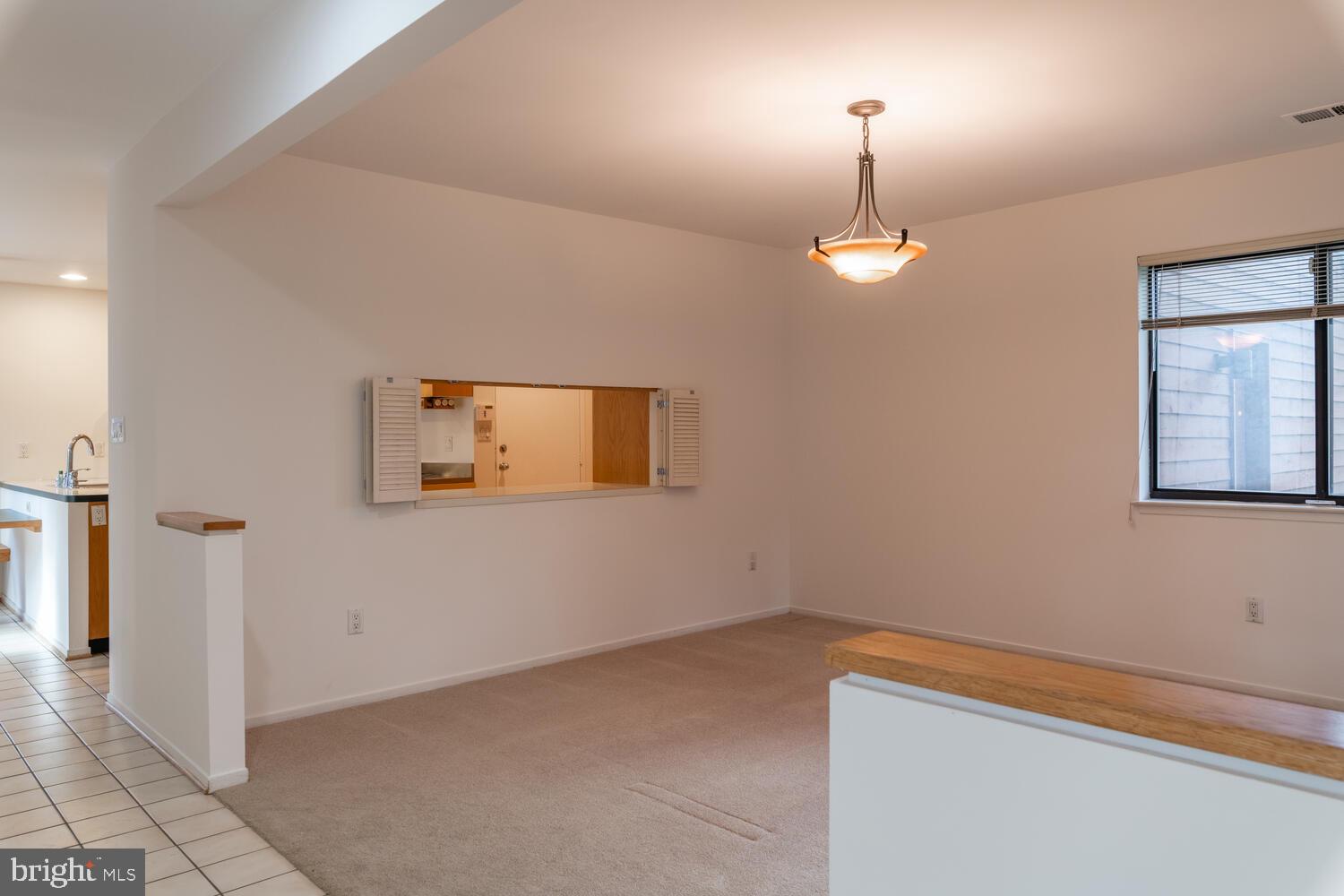 2100 South Bay Lane Reston, VA 20191 - Photo 8 of 43 Open Dining Room with Chandelier and Pass-through