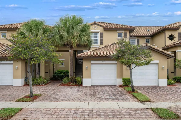 a house that has a tree in front of it