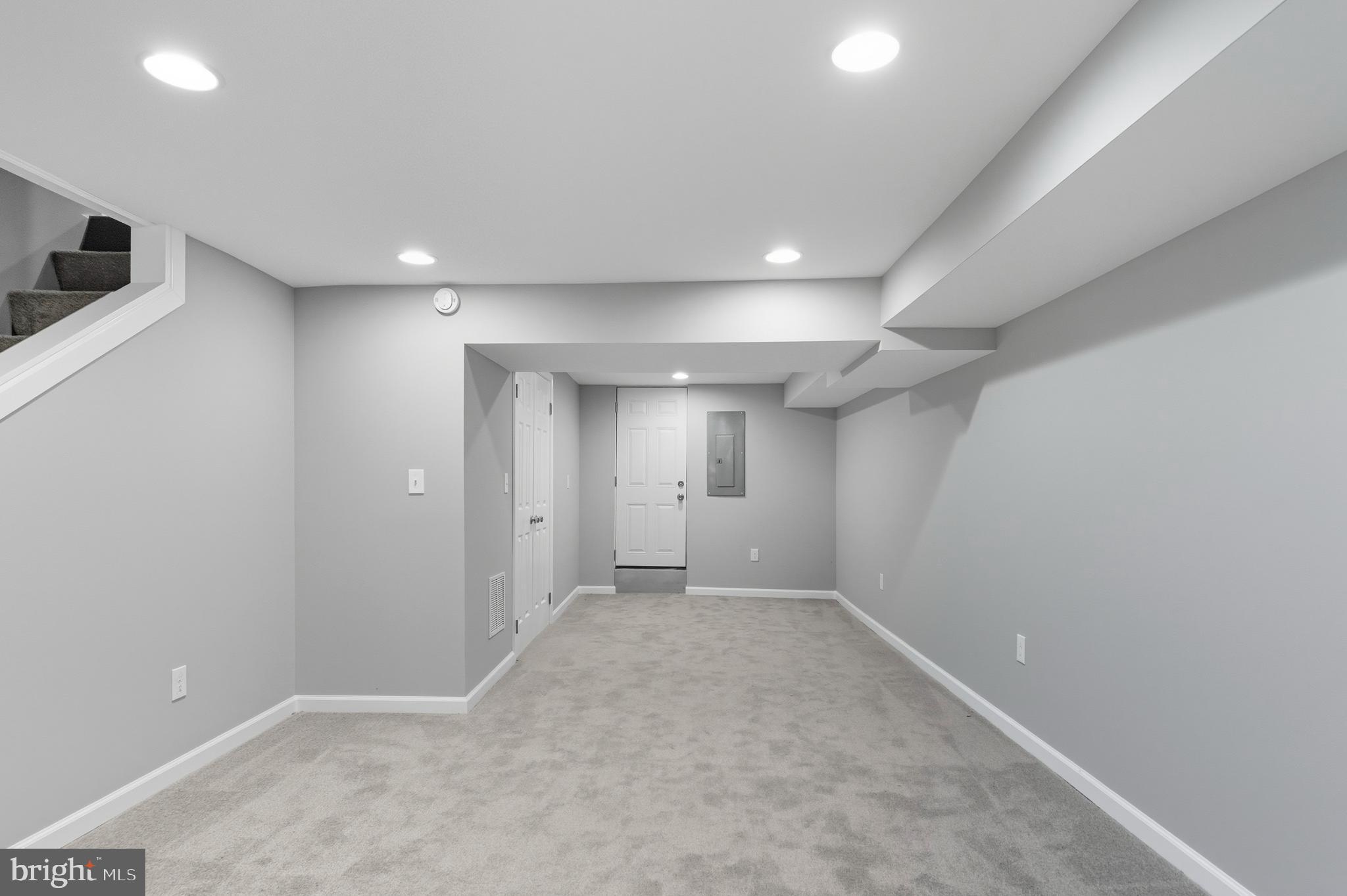 809 East Pontiac Avenue Baltimore, MD 21225 - Photo 27 of 36 an empty room with windows and natural light