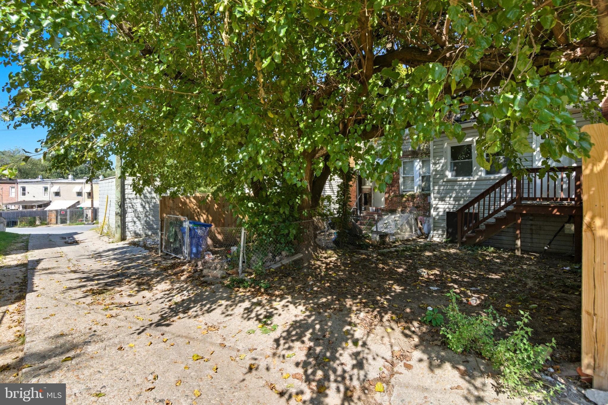 809 East Pontiac Avenue Baltimore, MD 21225 - Photo 34 of 36 a view of a backyard with trees