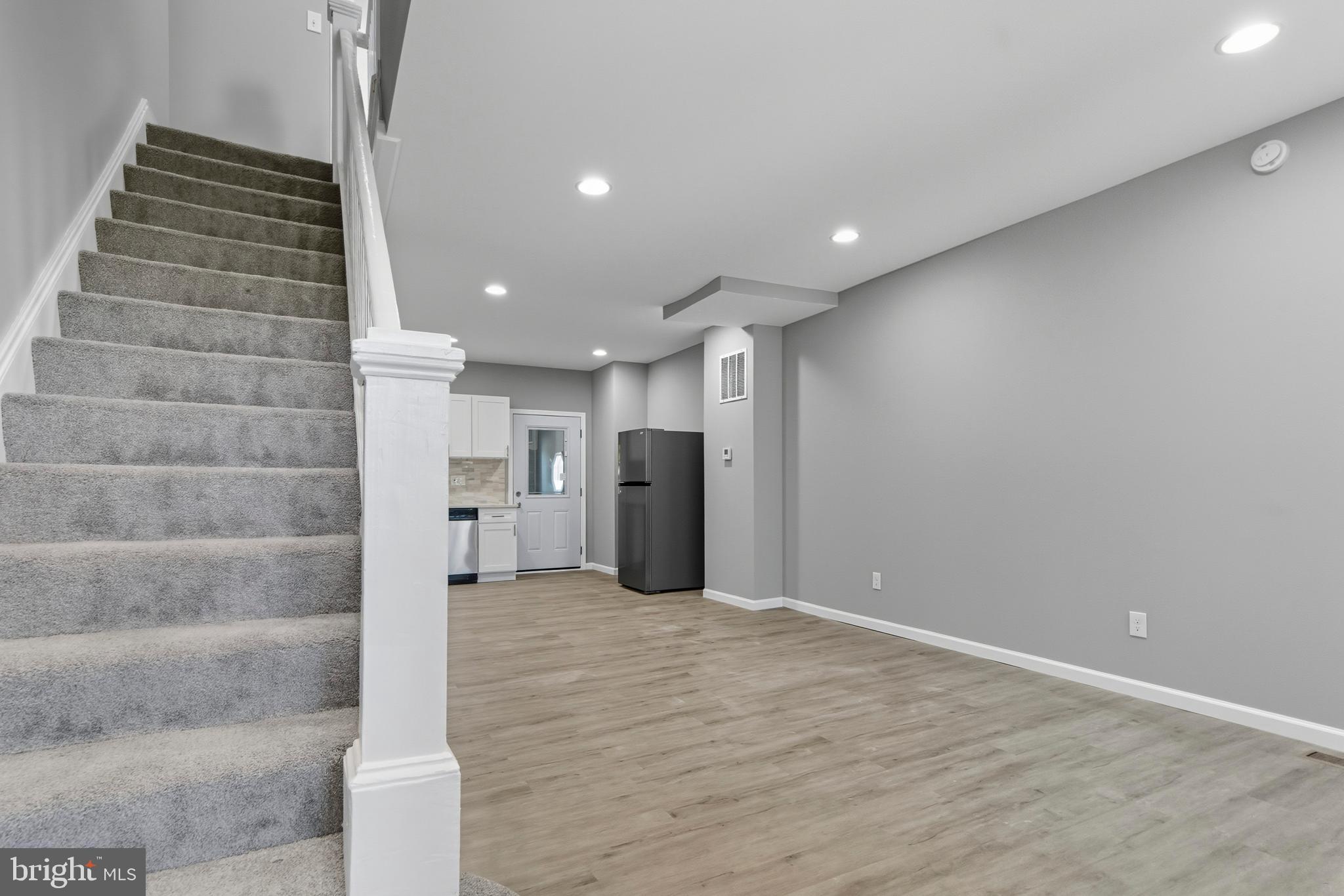 809 East Pontiac Avenue Baltimore, MD 21225 - Photo 5 of 36 a view of an empty room with a fireplace