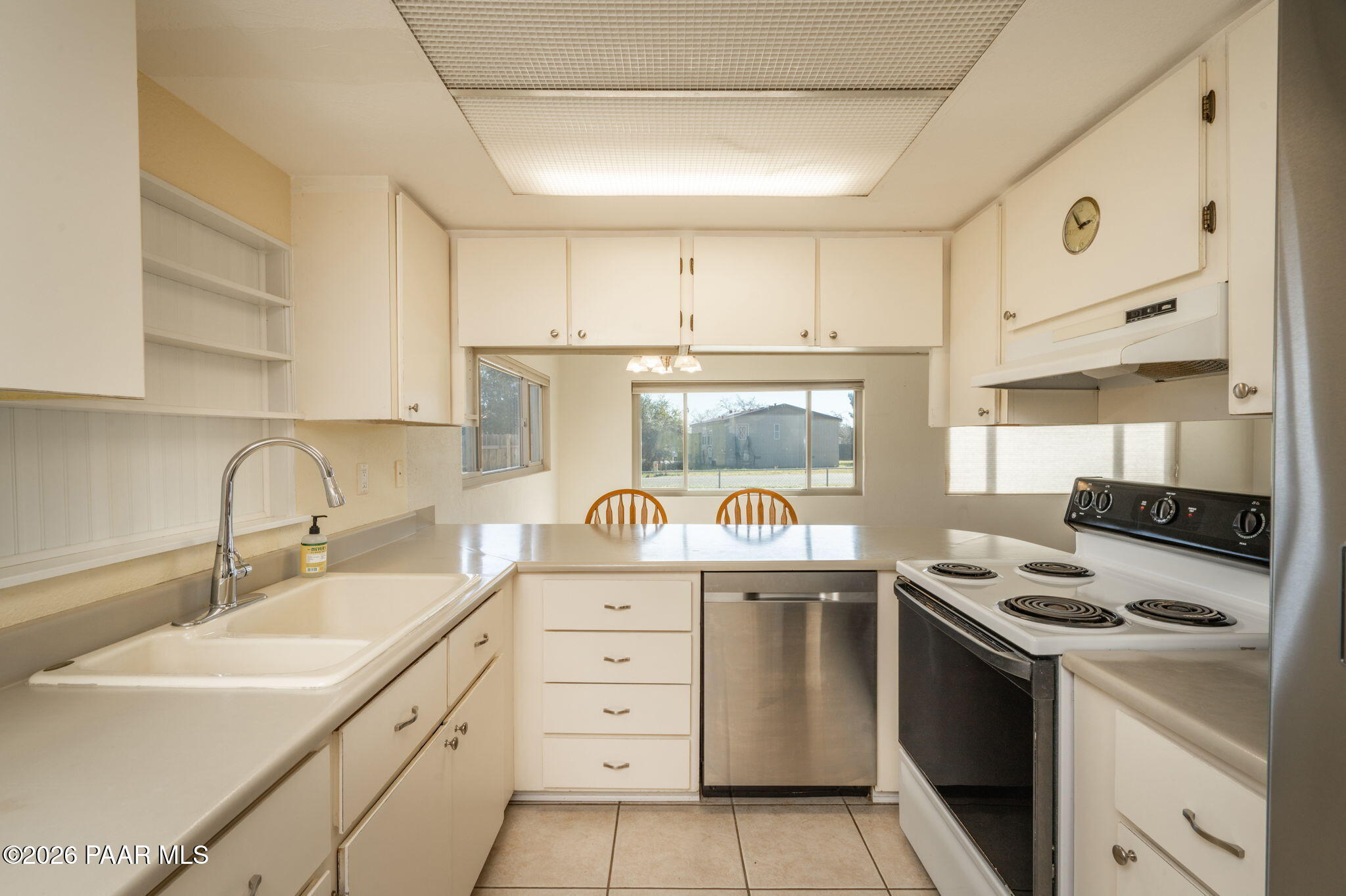 17270 East Peach Tree Road Mayer, AZ 86333 - Photo 7 of 31 a kitchen with a stove a sink and a refrigerator