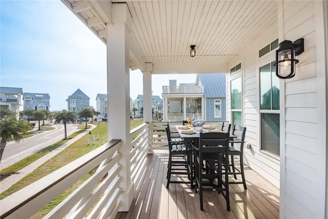 a view of a dining room with furniture wooden floor and chandelier
