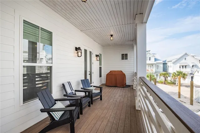 a view of a living room and a balcony