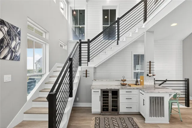 a kitchen with granite countertop a sink and cabinets