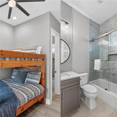a spacious bathroom with a toilet sink and shower