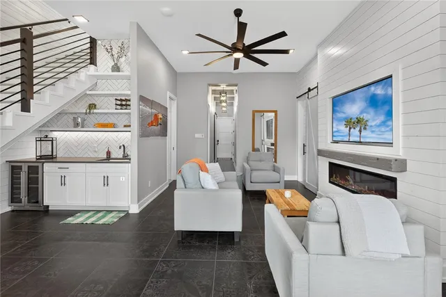 a living room with furniture and a flat screen tv