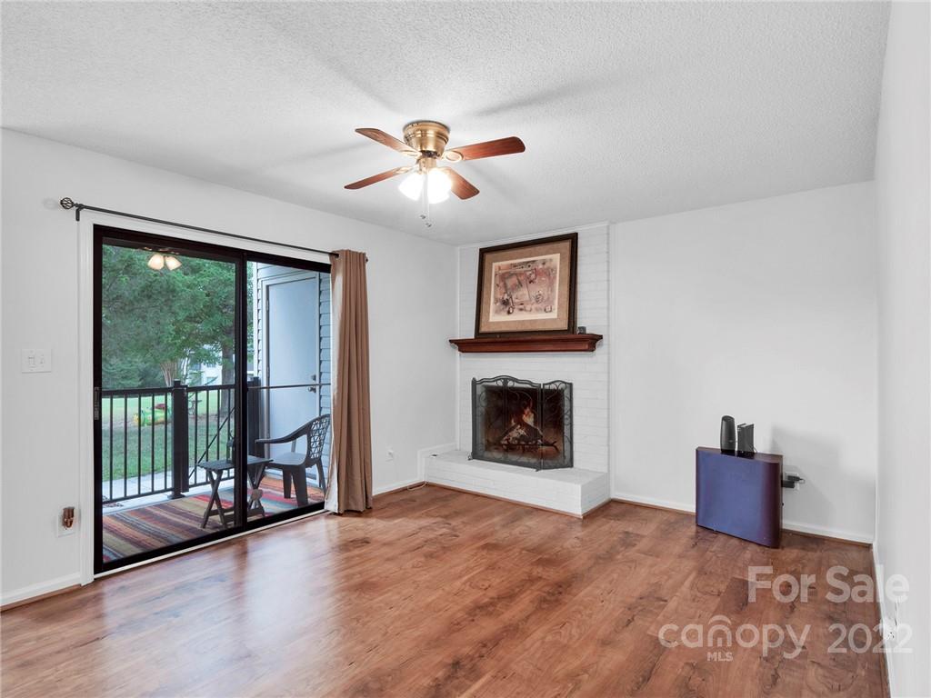 11058 Running Ridge Rd. Charlotte, NC 28226 - Photo 6 of 16 a view of an empty room with window and a fireplace