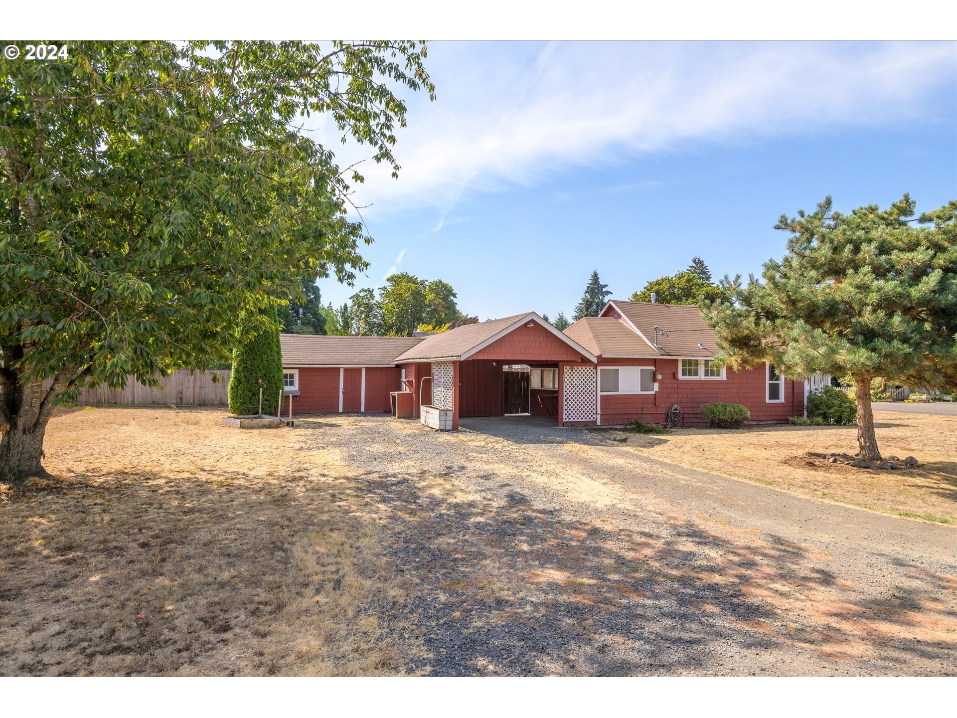 91019 South Coleman Street Eugene, OR 97408 - Photo 20 of 29 a front view of a house with a yard and garage