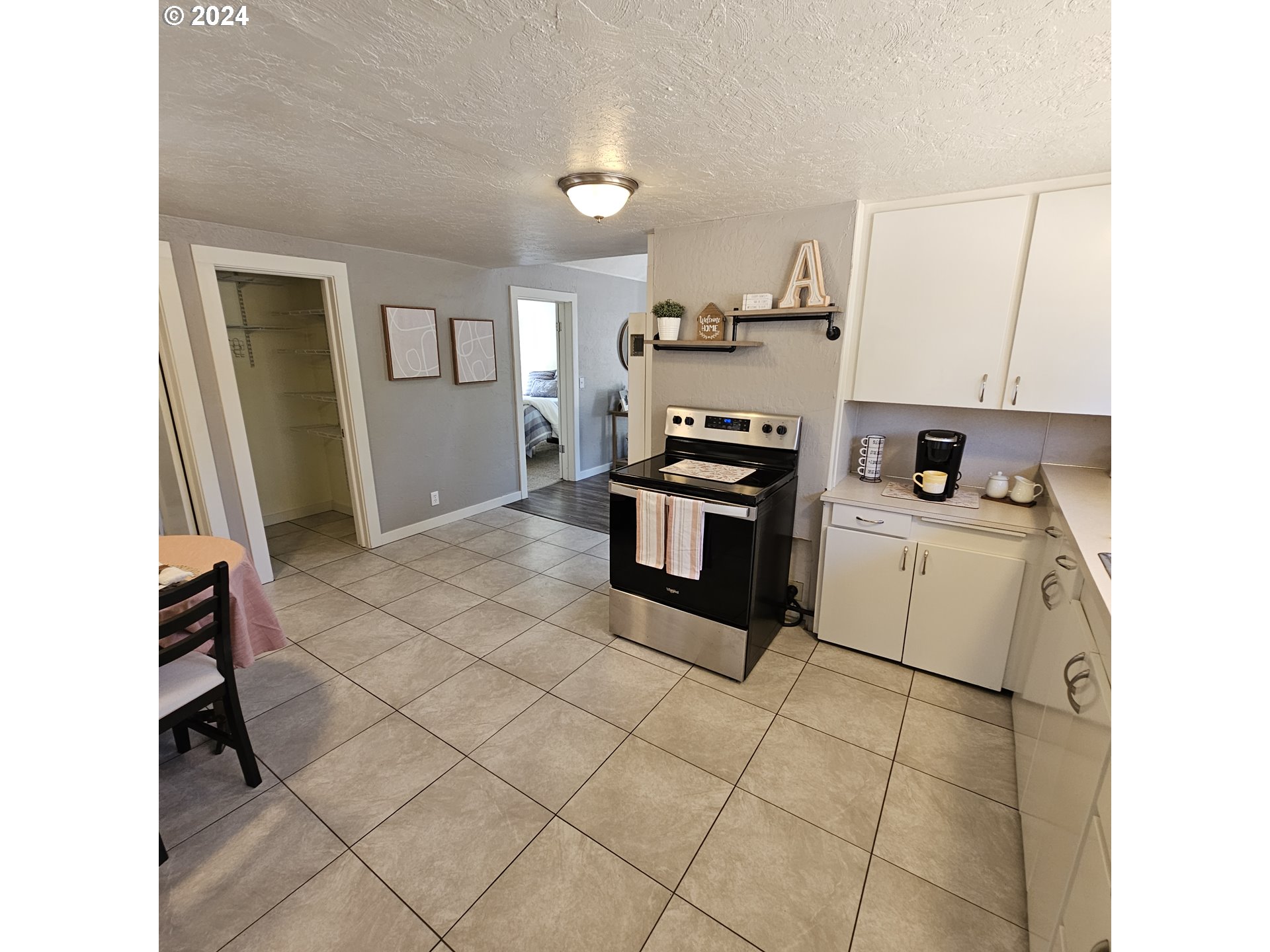 91019 South Coleman Street Eugene, OR 97408 - Photo 8 of 29 a kitchen with stainless steel appliances a stove a sink and a refrigerator