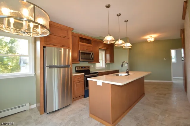 a kitchen that has a lot of cabinets in it
